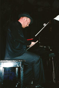 Adam Rudegeair playing piano